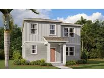 Charming two-story home with classic siding, manicured lawn, and inviting front entrance at 2467 Zuni Road, St Cloud, FL 34771