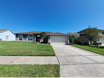 Charming single-Gathering home with a well-maintained lawn and two car garage at 2863 Middleton Cir, Kissimmee, FL 34743