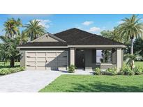 Charming one-story home featuring a two-car garage, stylish front door, and lush landscaping at 404 Taylor Groves Dr, Lake Wales, FL 33853