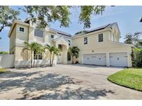 Elegant home with a three-car garage, well-maintained landscaping, and solar panels at 1302 Shelter Rock Rd, Orlando, FL 32835