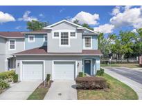 Charming two-story townhome with attached garage and well-maintained landscaping at 2288 Leland Ln, Casselberry, FL 32707