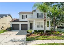 Charming two-story home featuring a well-manicured front yard and a spacious two-car garage at 3752 Cleary Way, Orlando, FL 32828