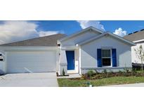 Charming single-Gathering home featuring a bright blue front door and white exterior at 707 Staffora St, Haines City, FL 33844
