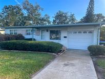 Charming single-story home with well-maintained landscaping and an attached one car garage at 766 Canovia Ave, Orlando, FL 32804