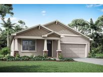 Charming single-story home featuring a classic design, a two-car garage, and a well-manicured lawn at 13216 Pergola Ave, Orlando, FL 32832