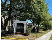 Regency Gardens Condominiums entrance sign and lush landscaping add to the property's appeal at 4225 Thornbriar Ln # 305, Orlando, FL 32822