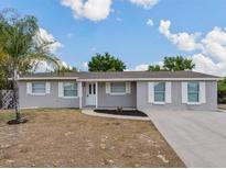 Charming single-story home with a well-maintained yard and neutral gray paint at 4739 Elkmont Rd, Orlando, FL 32808