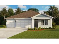 Charming single-story home with a three-car garage, neat landscaping, and a welcoming entrance at 1487 Fountain View St, Ormond Beach, FL 32174