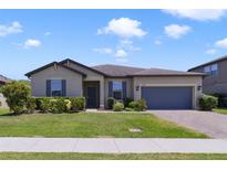 Charming single-story home with a two car garage, well-manicured lawn, and inviting curb appeal at 3629 Vega Creek Dr, St Cloud, FL 34772