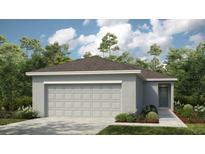 Charming single-story home with a two-car garage and well-maintained landscaping at 5113 Forget Me Not Ave, Lake Hamilton, FL 33851