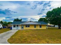 Charming single-story home featuring a cozy front porch and well-maintained lawn at 606 E Central Ave, Eagle Lake, FL 33839