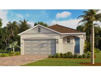 Charming single-story home with a blue front door, paver driveway and lush landscaping at 3973 Kennebunk Loop, Mount Dora, FL 32757