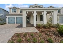 Charming two-story home with a two-car garage and inviting front porch with brick pavers at 13181 Telsen St # 39, Winter Garden, FL 34787