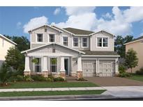 Charming two-story home featuring a welcoming front porch and a three-car garage at 13187 Telsen St # 38, Winter Garden, FL 34787