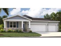 Beautiful single-Gathering home with a large two-car garage and well-manicured lawn at 1335 Wood Line Dr, Deland, FL 32720