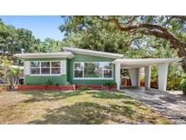 Charming single-story home featuring a carport and well-maintained landscaping at 141 S Lawsona Blvd, Orlando, FL 32801