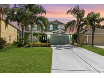 Charming two-story home boasts lush landscaping, a two-car garage, and a welcoming front entrance at 2842 Balforn Tower, Winter Garden, FL 34787