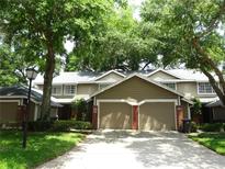 Charming townhome with a two-car garage and mature landscaping providing shade at 672 Post Oak Cir # 106, Altamonte Springs, FL 32701