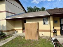 Charming townhouse features a fenced front yard and freshly painted exterior at 963 Stucki Ter, Winter Garden, FL 34787