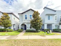 Charming two-story home features a manicured lawn, tasteful landscaping, and a welcoming entryway at 11091 Bagley Aly, Windermere, FL 34786