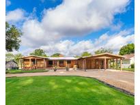 Stunning single story home with wooden facade and spacious covered parking at 2814 Conway Gardens Rd, Orlando, FL 32806