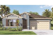 Charming single-story home with a neutral color palette, a two-car garage and lush landscaping at 4578 Boxwood Way, Mount Dora, FL 32757