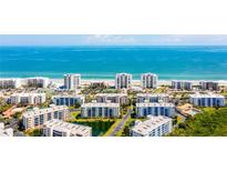 Aerial view of beachfront condo buildings and the expansive oceanfront at 5300 S Atlantic Ave # 6-502, New Smyrna Beach, FL 32169