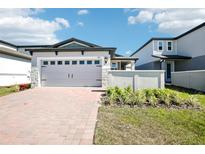 Charming single Gathering house with red brick driveway and a 2-car garage at 667 Pennywort St, Lake Alfred, FL 33850