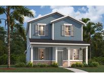 Charming two-story home featuring a covered front porch, blue siding, and lush landscaping at 305 Platform Ln, Debary, FL 32713
