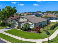 Well-maintained home featuring lush landscaping, a neat lawn, and a fenced backyard at 570 Cascading Creek Ln, Winter Garden, FL 34787