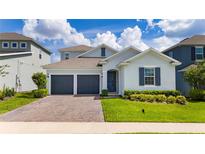 Charming single-Gathering home with a two-car garage and manicured lawn at 2591 Seagirt Way, Clermont, FL 34711