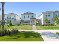 Charming two-story home with a well-manicured lawn and inviting curb appeal at 10959 Vesper Aly, Orlando, FL 32829