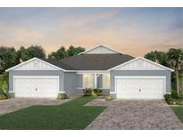 Charming single-story home featuring a symmetrical design, two-car garage, and neatly landscaped front yard at 2458 Cliff Way, St Cloud, FL 34771
