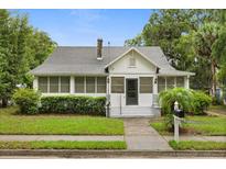 Charming two-story home with a well-manicured lawn, classic architecture, and inviting front entrance at 40 W Smith St, Winter Garden, FL 34787