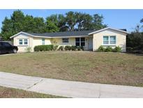 Charming single-story home featuring a well-manicured lawn and inviting front entrance at 1364 Gainesville Dr, Deltona, FL 32725
