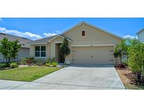 Charming single-story home with a well-manicured lawn and a two-car garage at 1836 Partin Terrace Rd, Kissimmee, FL 34744