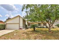 Charming single-Gathering home with a well-maintained lawn and mature trees, adding curb appeal at 309 Panama Cir, Winter Springs, FL 32708
