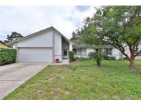 Charming single Gathering home featuring a well-manicured lawn and attached garage in a desirable neighborhood at 309 Panama Cir, Winter Springs, FL 32708
