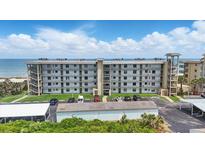 Beautiful beachfront condo building with ample parking, offering stunning ocean views and convenient beach access at 3180 Ocean Shore Blvd # 407, Ormond Beach, FL 32176