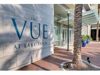 Exterior daytime view of The Vue at Lake Eola building entrance and landscaping in downtown Orlando, Florida at 150 E Robinson St # 626, Orlando, FL 32801