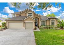 Charming home with a three-car garage and beautiful landscaping at 1837 Sweetwater West Cir, Apopka, FL 32712