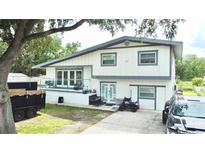 Charming two-story home with a modern exterior and well-maintained landscaping at 2932 Larson St, Kissimmee, FL 34741