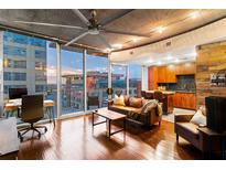 Inviting living room featuring modern decor, hardwood floors, and city views at 155 S Court Ave # 1608, Orlando, FL 32801