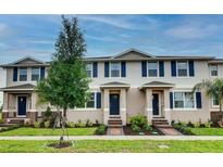 Charming townhomes with manicured lawns and tasteful landscaping create welcoming curb appeal at 1562 Dalehurst Ln, Kissimmee, FL 34744
