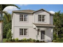 Charming two-story home with gray siding, manicured landscaping, and a welcoming front entrance at 2383 Zuni Road, St Cloud, FL 34771