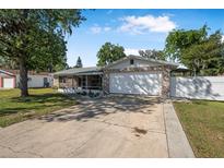 Charming single-story home with stone accents and a well-maintained front yard under a bright, sunny sky at 3714 Paige St, Port Orange, FL 32127