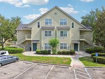 Inviting two-story condo building with well-maintained landscaping, private entrances, and parking area at 3721 S Lake Orlando Pkwy # 05, Orlando, FL 32808
