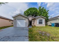 Charming single-story home featuring a one-car garage and well-maintained lawn at 5423 Blueberry Dr, Orlando, FL 32811