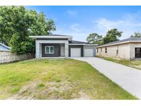 Charming single-Gathering home with a well-maintained lawn and a two-car garage at 5438 Brownell St, Orlando, FL 32810