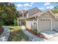 Charming two-story home featuring a well-maintained lawn and an attached one-car garage at 609 Northbridge Dr, Altamonte Springs, FL 32714